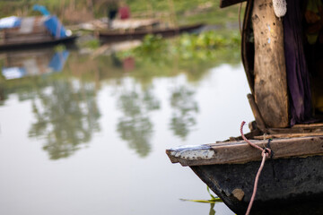 Living fishing wood boat parked at the bank of a river in Bangladesh