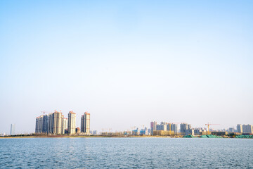 Fototapeta premium A modern city by the lake