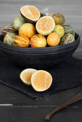 Organic Fresh Healthy Vegetable Yellow Cucumbers or Yellow Pumpkin on Wooden Background