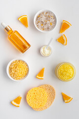 Care cosmetics with vitamin C. mask, cream, serum and bath salt with orange oil and vitamin C. Flat lay. Nop view.