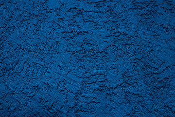 The wall is made of plaster with scratches. Rough surface. abstract blue background. A template for the design of a website or ad.
