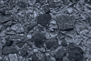 Abstract background of many large stones. Blank stone surface with a neutral color. Blank for design.