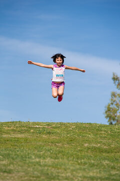 Girl Jumping in  photo at the park