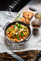 winter soup with vegetables and herbs