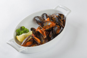 Blue mussels in tomatoes, white background