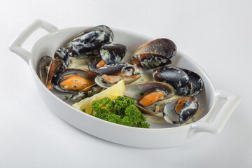 Double-leaf mussels in creamy mustard sauce, white background