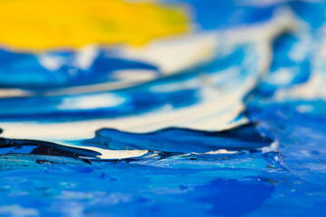 Abstract mixed oil paint colors close up macro shot for background.