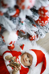 Merry bright christmas. Lovely baby enjoy christmas. Childhood memories. Santa girl little child celebrate christmas at home. Family holiday. Girl cute child cheerful mood play near christmas tree.