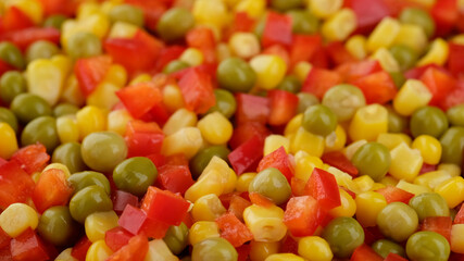 mixed vegetables chopped paprika pepper, canned green pea and corn. frozen vegetables top view