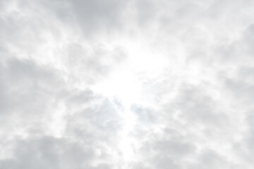 Group of clouds filled the sky, blocking the intense sunlight, clouds turn to be light gray
