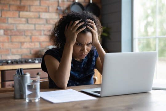 Confused Young African Ethnicity Woman Looking At Computer Screen, Feeling Stressed Of Reading Bad News, Getting Dismissal Notice By Email, Bank Loan Rejection Notification, Unlucky People Concept.