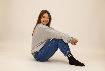 Beautiful blower sits on the floor of a student white background the joy of meditation calm...