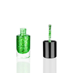Green glittering nail polish glass bottle, brush white background isolated close up, open green sequin varnish, bright shiny lacquer, sparkling enamel, beautiful shimmer gel, beauty cosmetic accessory