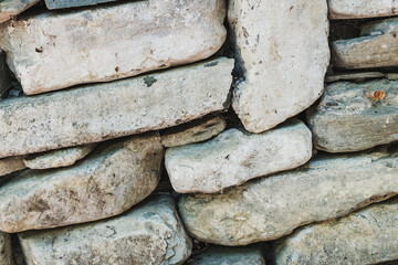 The ancient rusty old masonry stone texture for background and design concepts. the shadow. geology.