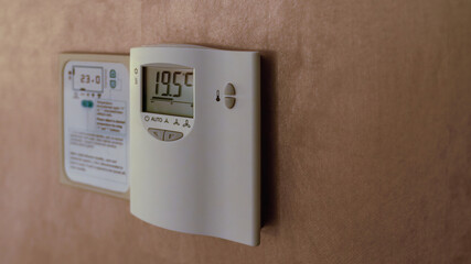 Digital Thermostat on the wall.