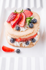 Delicious and healthy dessert with fresh berries and cream