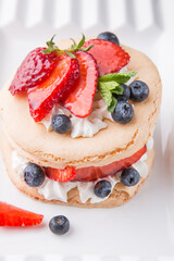 Delicious and healthy dessert with fresh berries and cream