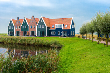 Fototapeta na wymiar Volendam is a town in North Holland in the Netherlands. Colored houses of marine park in Volendam.