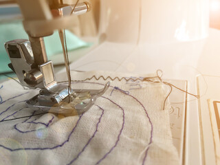 Close-up sewing machine pattern texture background.