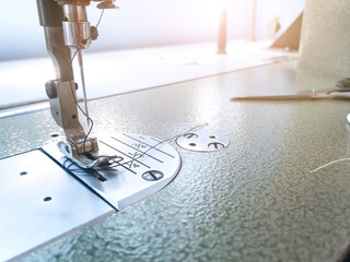 Close-up sewing machine pattern texture background.