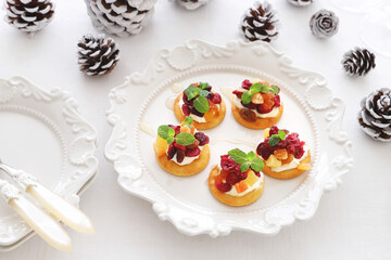 Christmas canapes with dried cranberry and cream cheese....