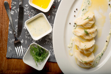delicious warm homemade dumplings with sauce and spices