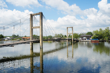 Suspension bridge over the river. Raksamea Bridge at Rayong, Thailand.