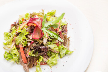 meat salad with fresh herbs in Georgian