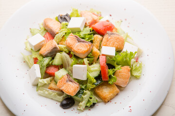 Greek salad with salmon