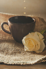 cup of coffee and rose
