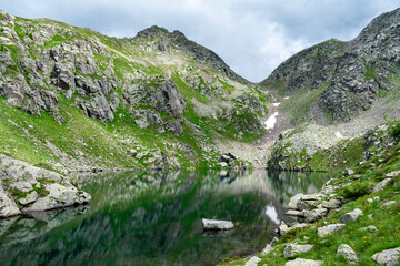 Naklejka na ściany i meble Italy, Trentino, Lagorai, Predazzo, Lago Brutto - 19 July 2020 - Enchanting glimpse of the Brutto lake