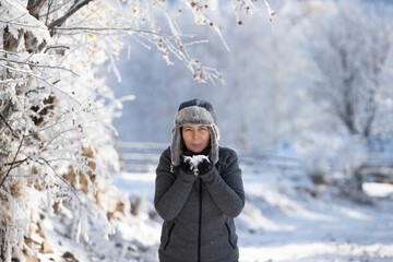 Fototapeta na wymiar Young woman in fairytale winter landscape.