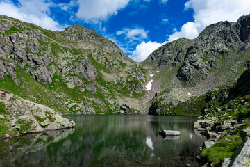 Fototapeta na wymiar Italy, Trentino, Lagorai, Predazzo, Lago Brutto - 19 July 2020 - View of the suggestive lake Brutto