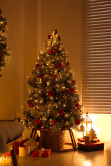 Beautiful decorated Christmas tree in festive room interior