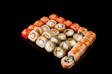 large set of rolls of fish and vegetables. Japanese food