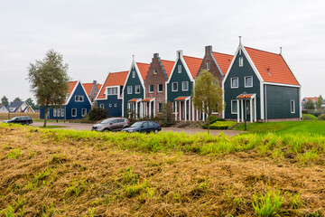 Fototapeta na wymiar Volendam is a town in North Holland in the Netherlands. Colored houses of marine park in Volendam.
