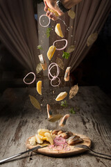 flying in the air pickled herring with boiled potatoes