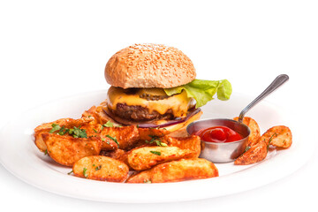 Super huge hamburger with baked French fries and ketchup