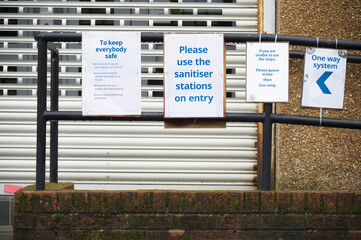 Use hand sanitiser before entering shop sign