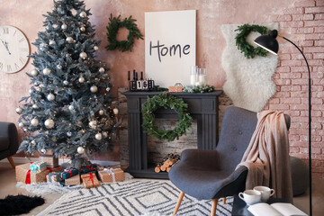 Interior of living room with fireplace decorated for Christmas