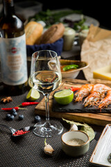 White wine stands next to the bottle. Snacks for white wine in the restaurant. Georgian restaurant