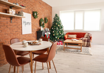 Interior of living room with fireplace decorated for Christmas