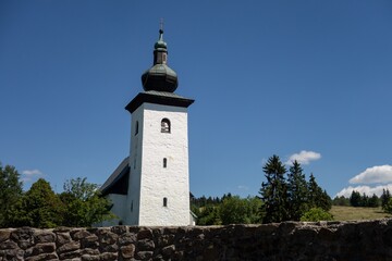 Geographical Centre of Europe (Geograficky stred Europy) near Kremnica and Kremnicke Bane, Slovakia with church tower