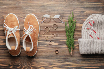 Christmas composition with stylish accessories on wooden background