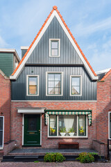 Volendam is a town in North Holland in the Netherlands. Colored houses of marine park in Volendam.