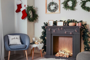 Decorated fireplace in interior of room on Christmas eve