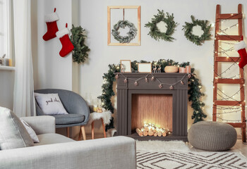 Decorated fireplace in interior of room on Christmas eve