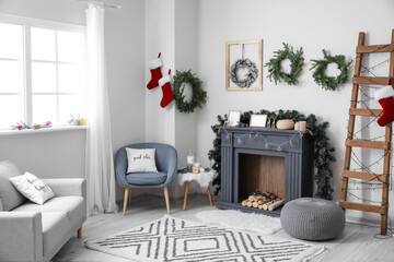 Decorated fireplace in interior of room on Christmas eve