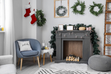 Decorated fireplace in interior of room on Christmas eve