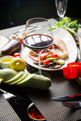 glass of dry red wine in a beautiful glass. Georgian cuisine. Georgian wine.